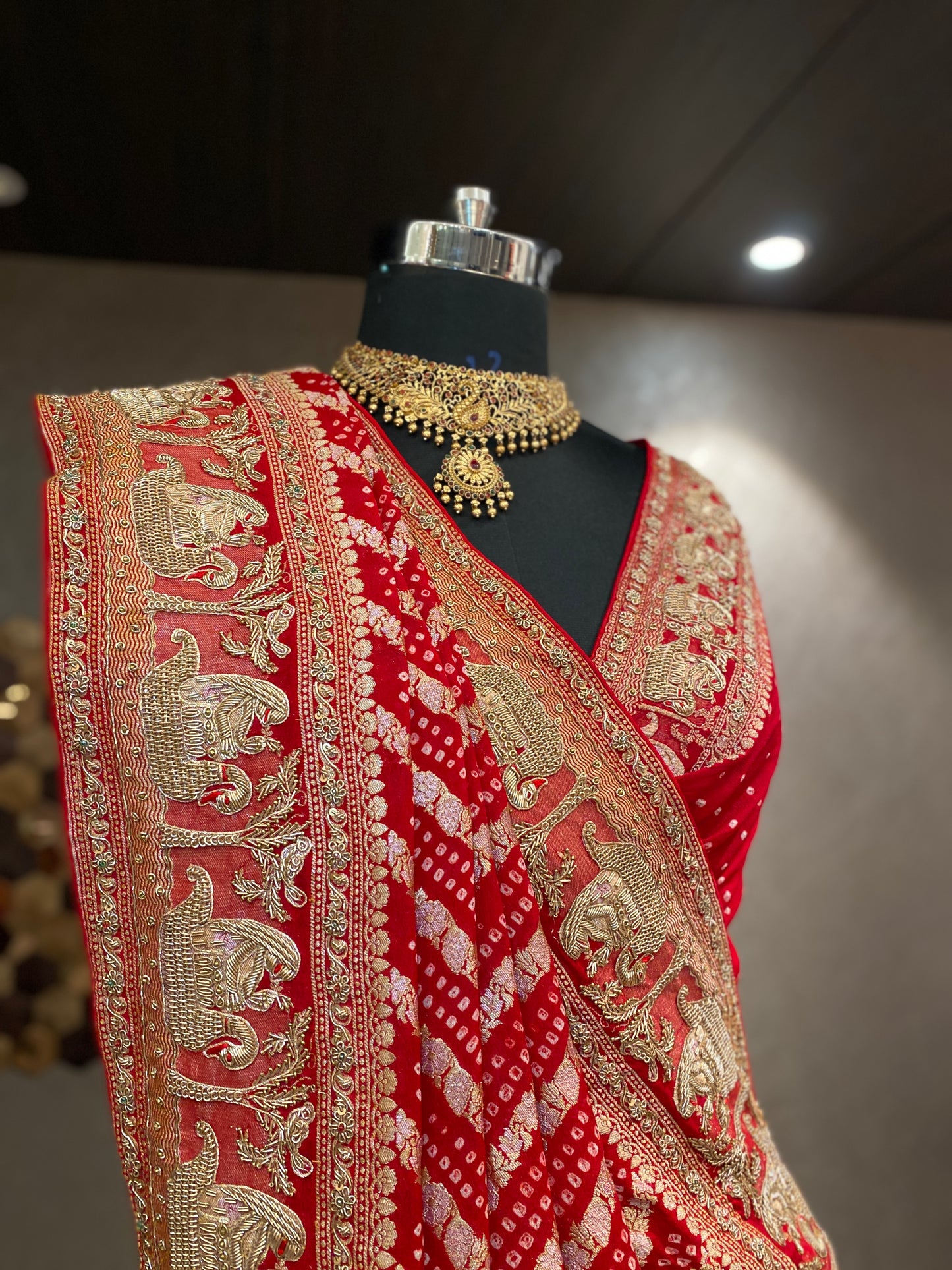 AN ELEGANT RED BANDHANI EMBROIDERED SAREE