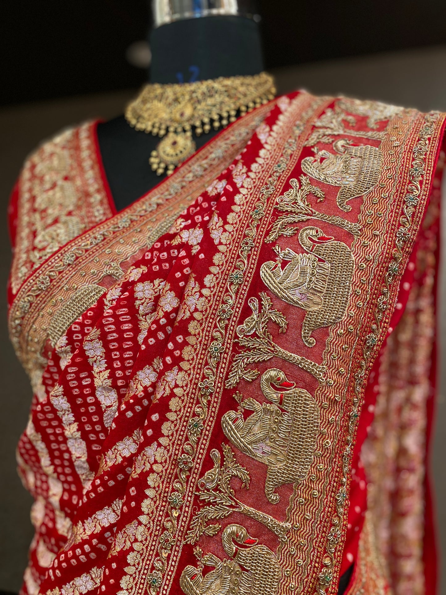 AN ELEGANT RED BANDHANI EMBROIDERED SAREE