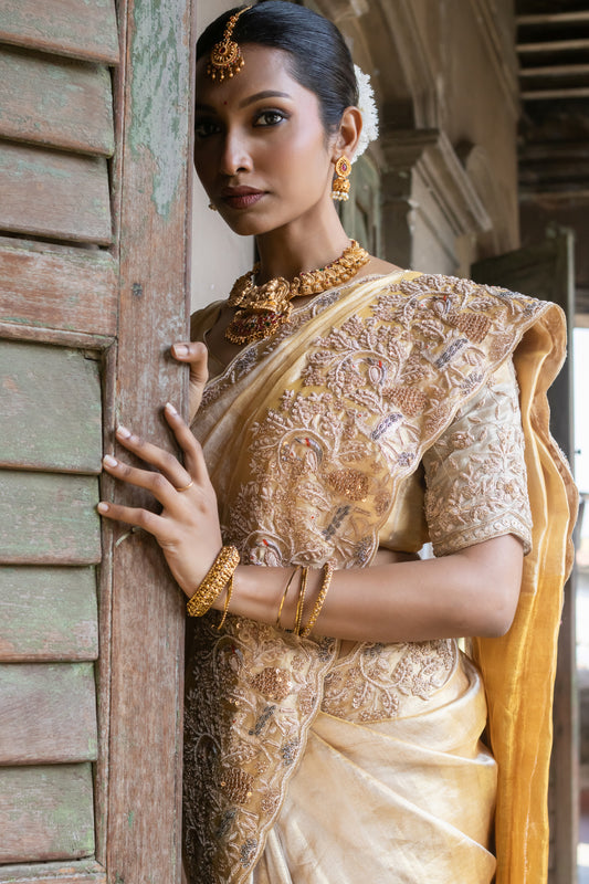 A PURE GOLD KANCHI TISSUE EMBROIDERED SAREE