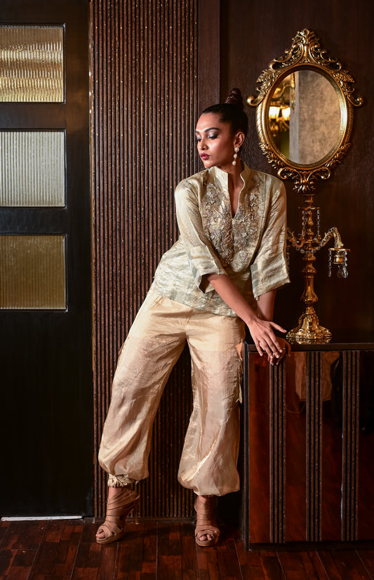 A BROCADE TOP PAIRED WITH TISSUE CARGO PANTS GS2050